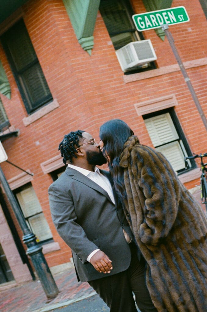 Couple sharing a quiet romantic moment captured on film in Boston with soft, dreamy light