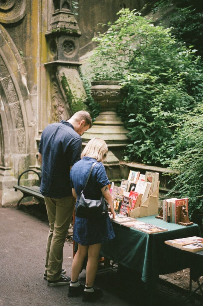 couple stopped to view books in nyc