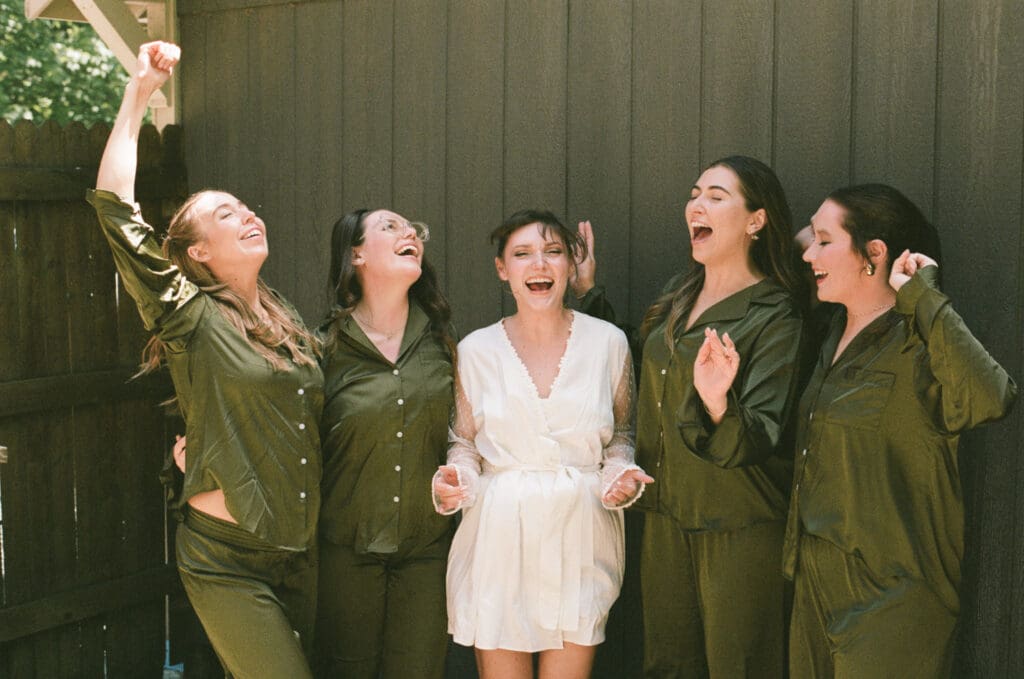 bride and her bridal party with matching pjs captured on 35mm film 