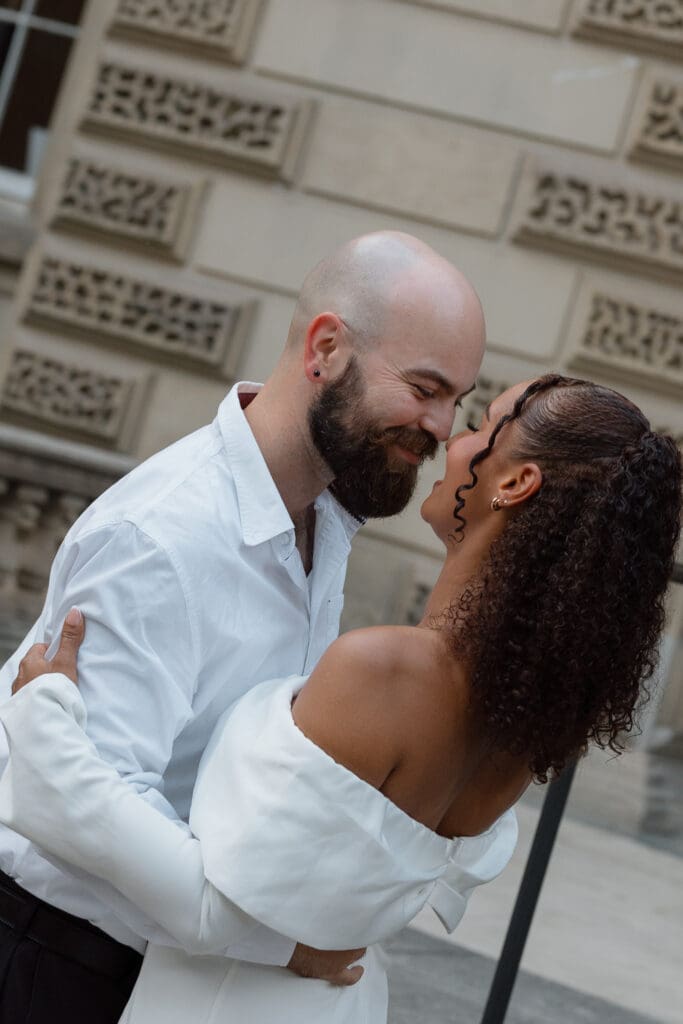 Close-up engagement portrait of Cheyanne and Keegan sharing a quiet moment at Osgoode Hall
