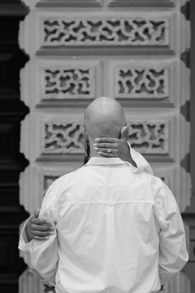 Elegant engagement photo of Cheyanne and Keegan in front of the historic Osgoode Hall building