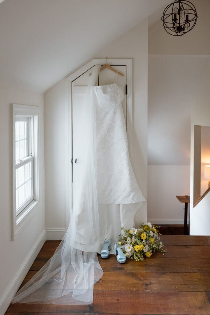 Wedding dress hanging before getting ready at Farm Road Estate
