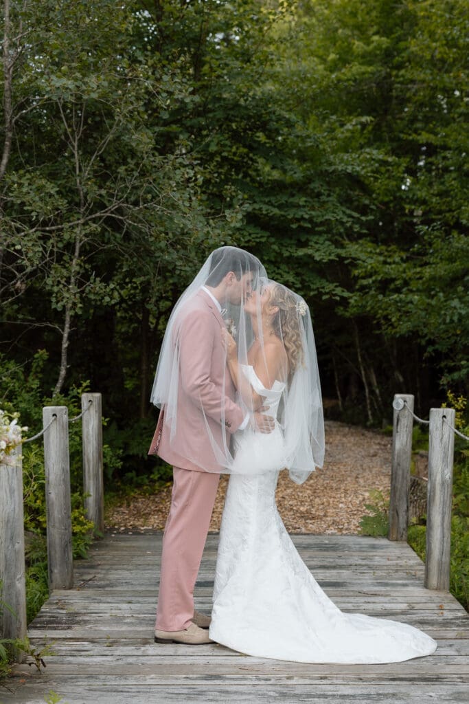 Bride and groom embracing during portraits in Vermont
