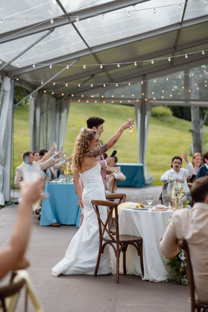 Bride and groom sharing their toast
