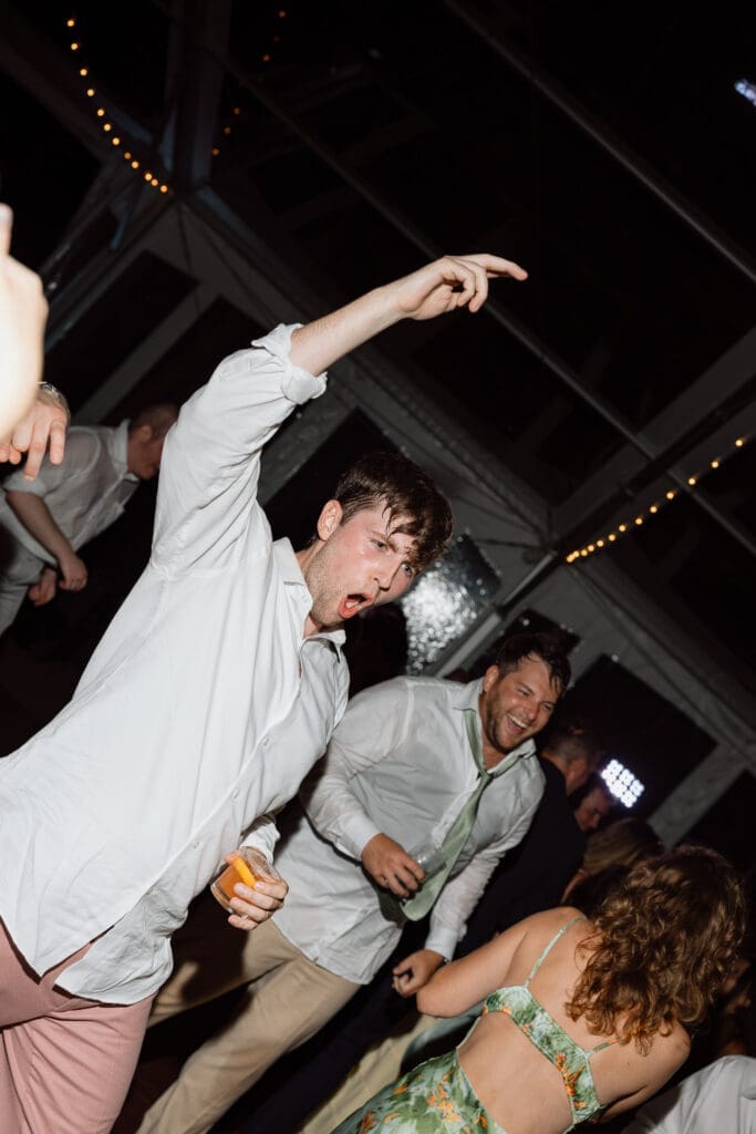 Groom dancing during the wedding reception
