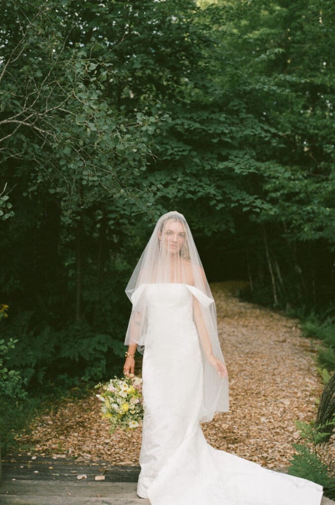 Bride wearing a veil during wedding portraits at Farm Road Estate
