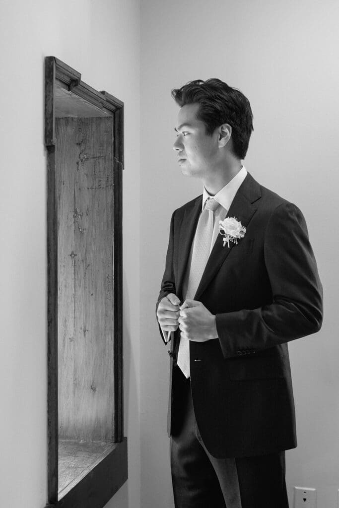 Black and white groom portrait inside Parque at Ridley Creek
