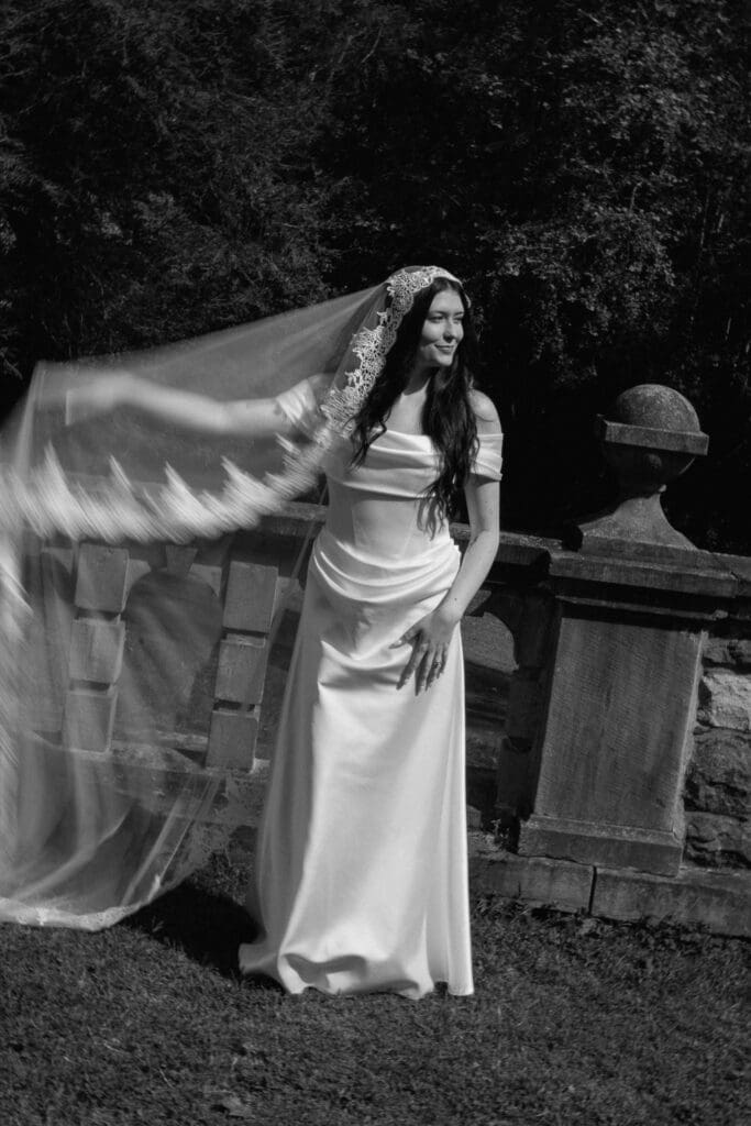 Bride wearing a lace veil at Parque at Ridley Creek
