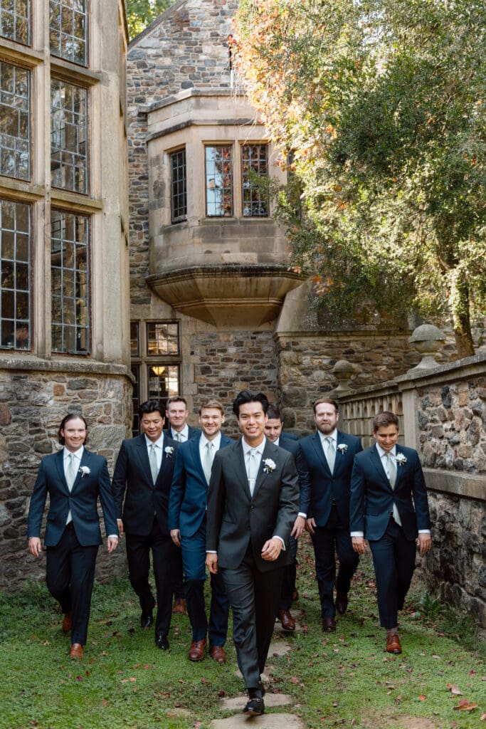 Groom and groomsmen walking outside Parque at Ridley Creek
