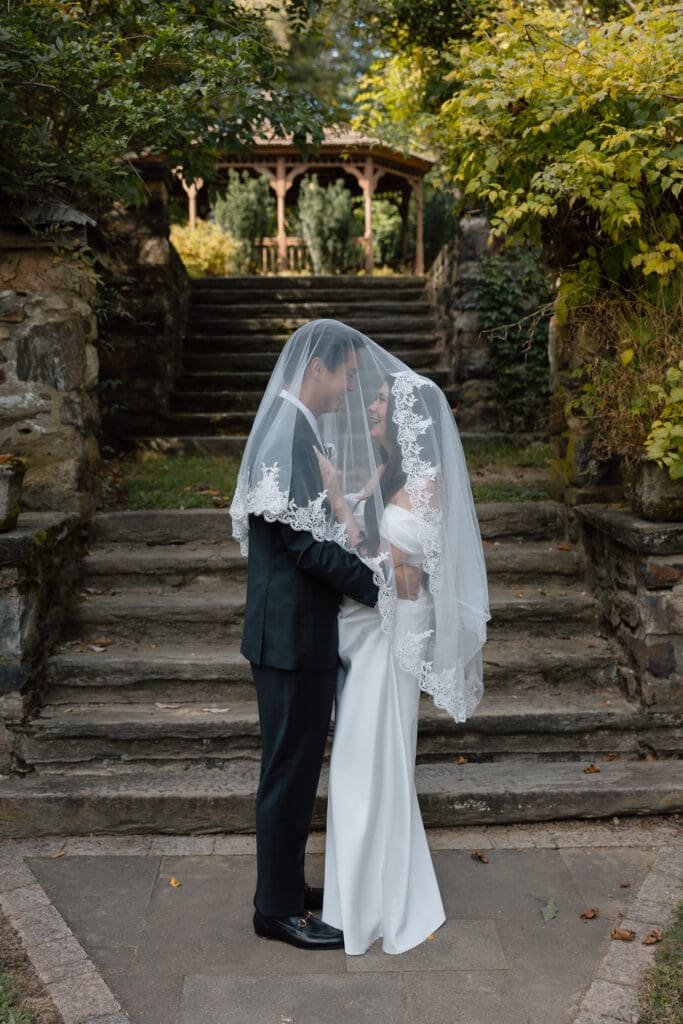 Bride and groom portrait on the garden steps at Parque at Ridley Creek
