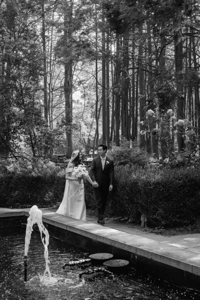 Bride and groom portrait by the fountain at Parque at Ridley Creek

