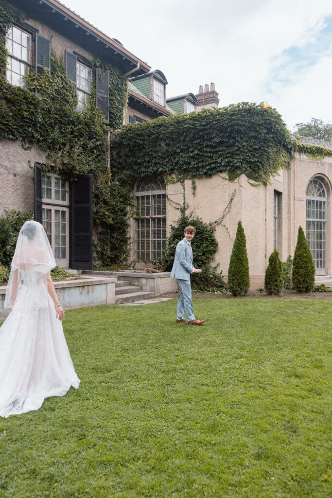 Bride approaching the groom for their first look at Parkwood Estate

