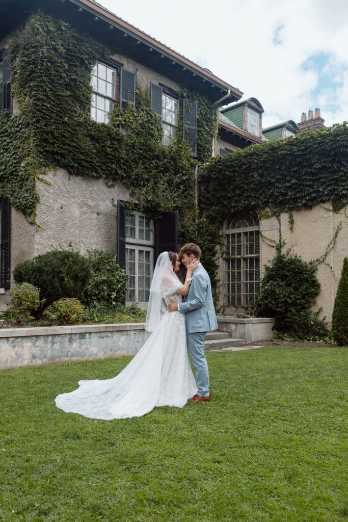 Bride and groom together on the lawn after their first look
