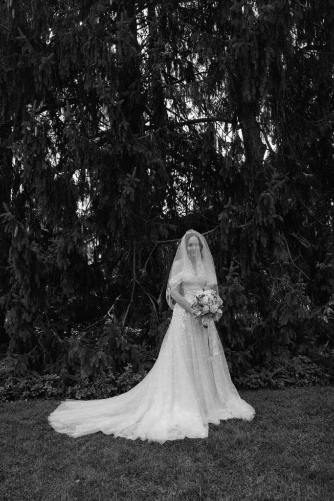 Black and white bridal portrait beneath the trees 