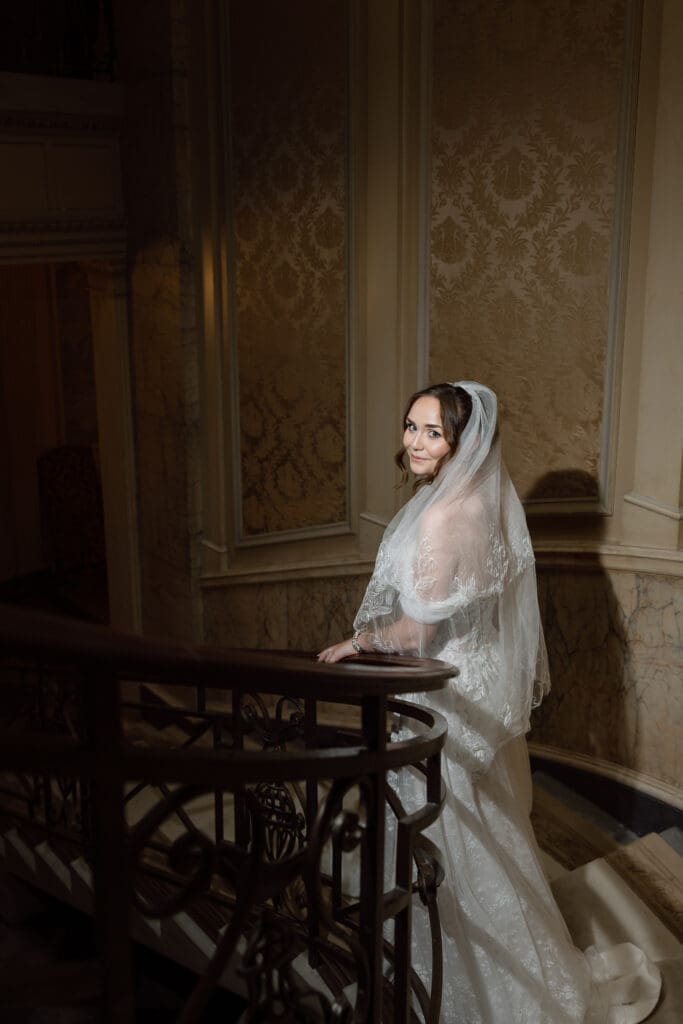 Bride portrait on the staircase inside the Parkwood Estate mansion
