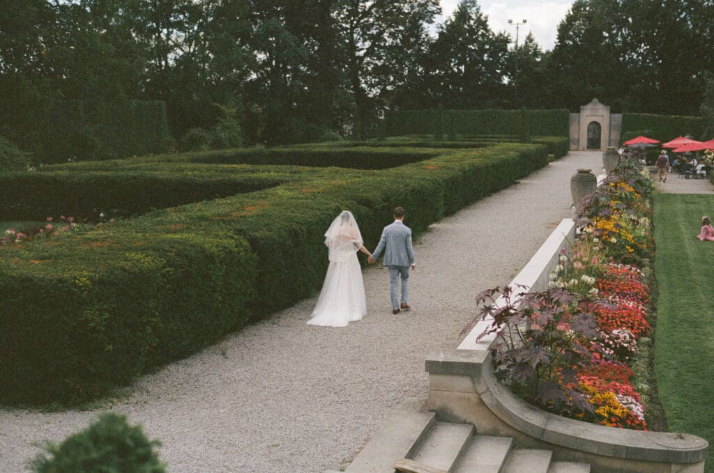 Bride and Groom walking in garden
